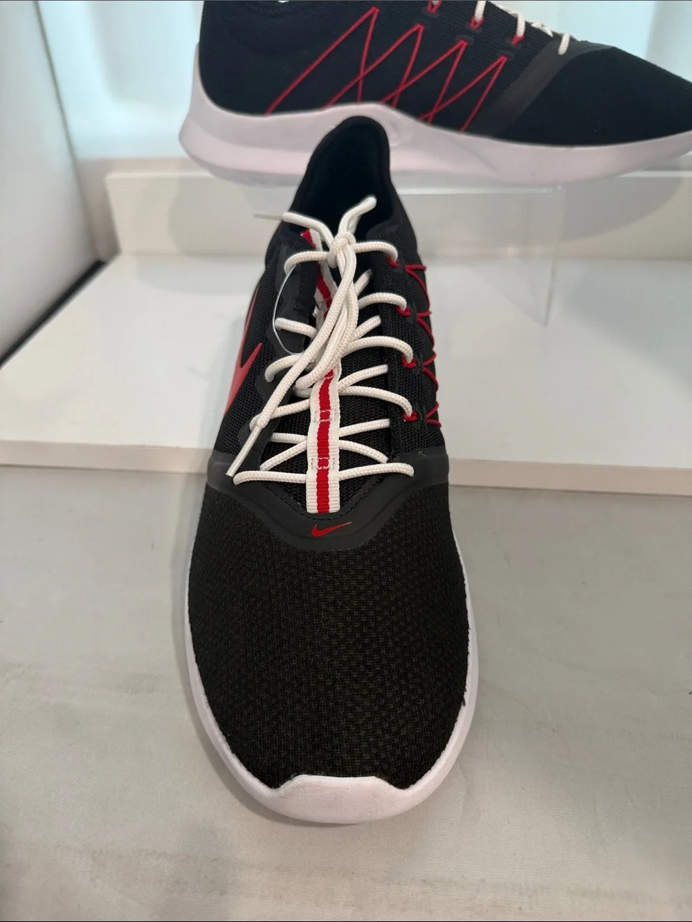 Nike Men's Black Athletic Shoes with Red Swoosh and White Sole